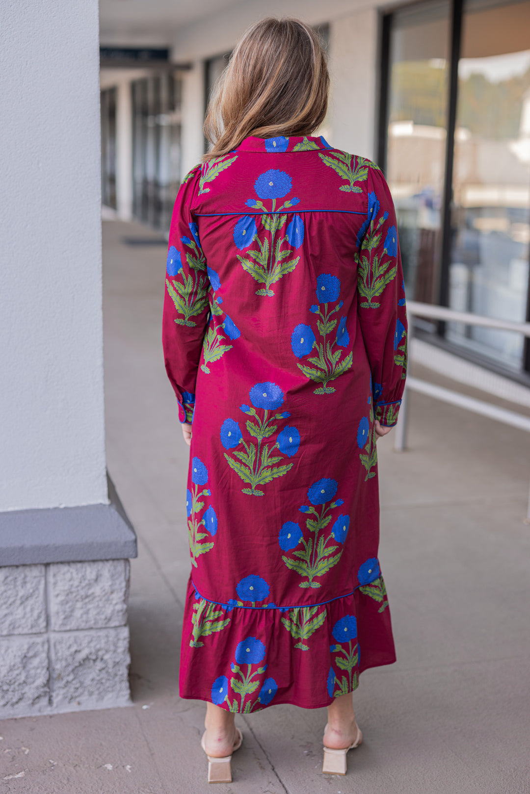 Women's burgundy midi dress with dark blue floral print and dark blue piping trim by Jodifl showing full back view