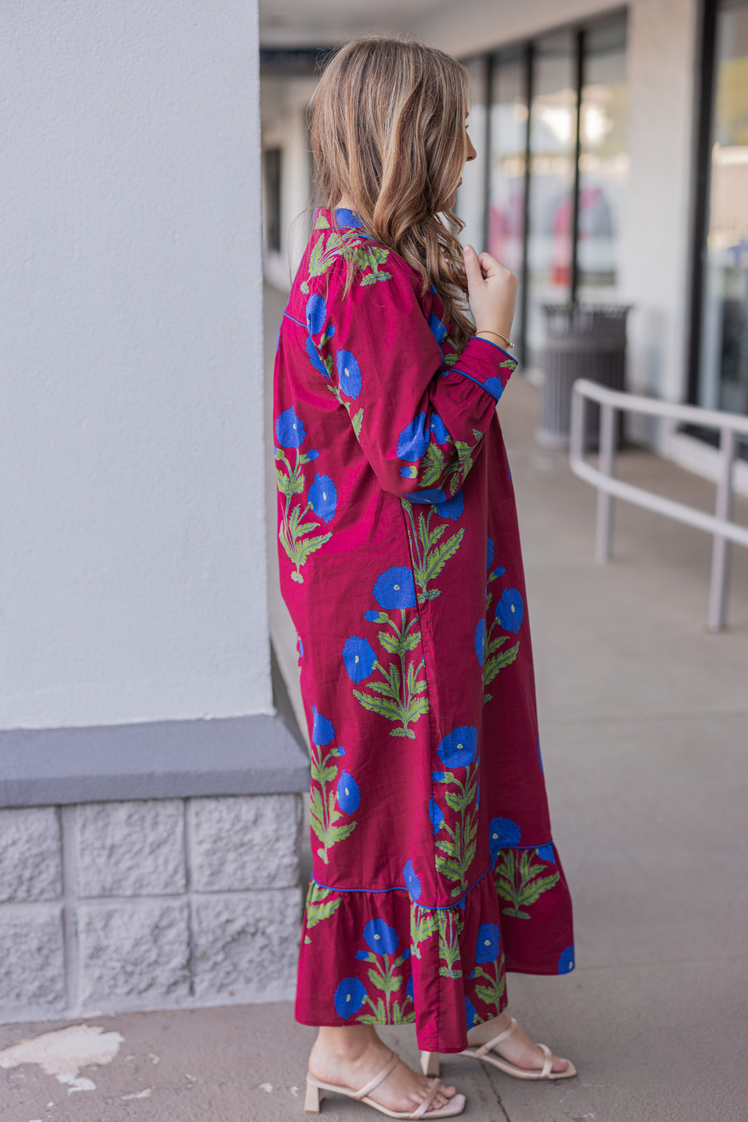 Women's burgundy midi dress with dark blue floral print and dark blue piping trim by Jodifl showing full side view