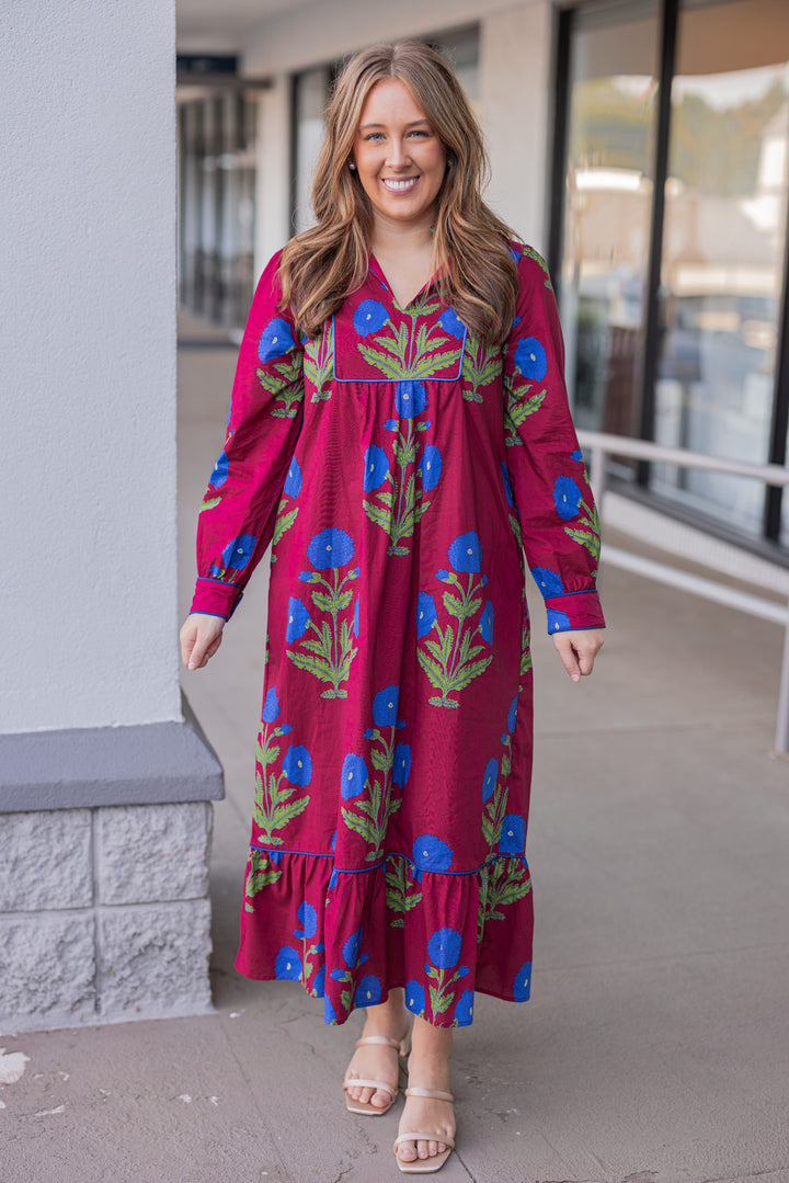 Women's burgundy midi dress with dark blue floral print and dark blue piping trim by Jodifl showing full front view