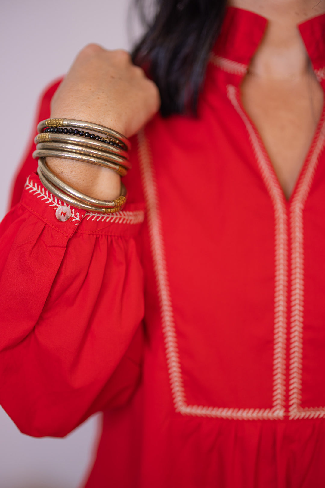 Women's red long sleeve ruched poplin dress by Wishlist showing taupe stitched details 