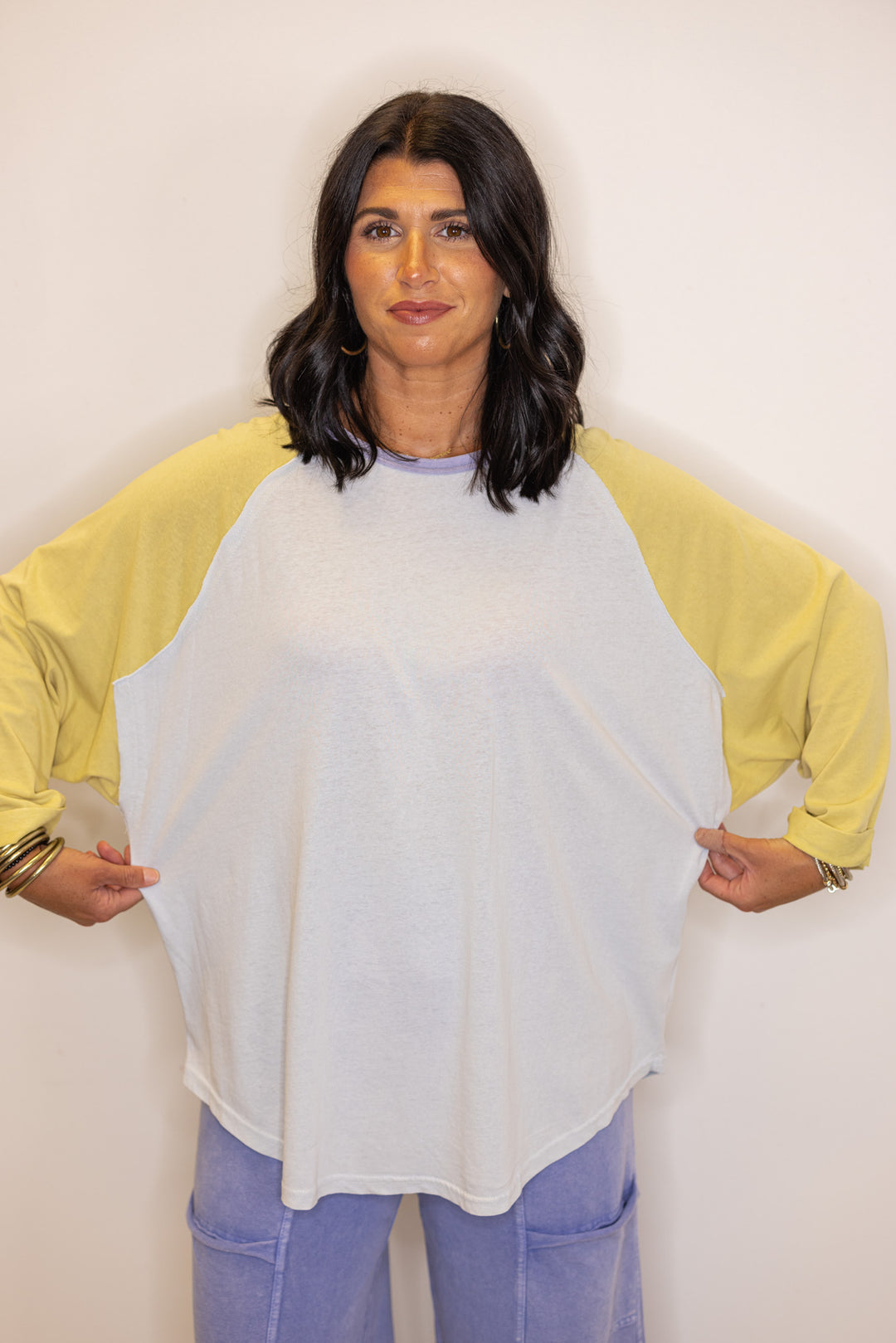 Women's light blue and dijon yellow colorblock knit top by Easel showing tops relaxed fit