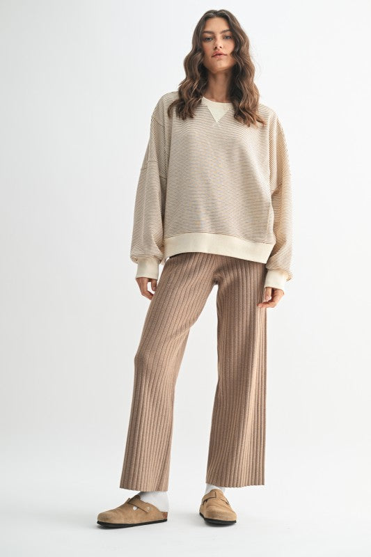 Women's ecru and caramel striped knit long sleeve pullover top by Wishlist showing full front view