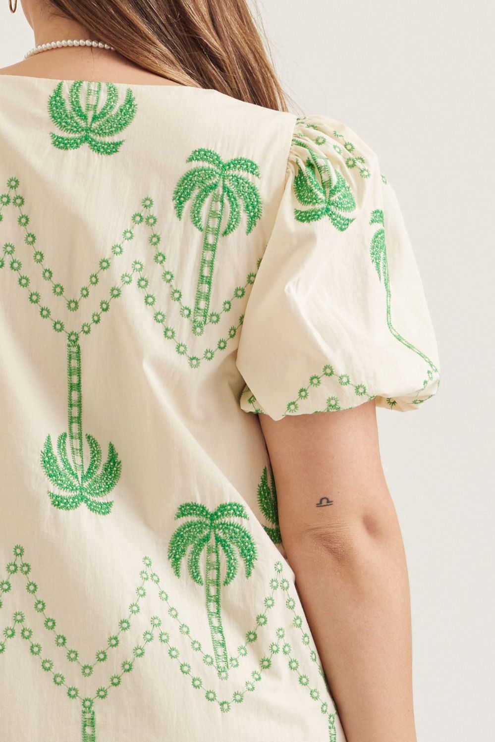 Entro plus size ecru button front dress with whimsical green embroidery palm trees throughout 