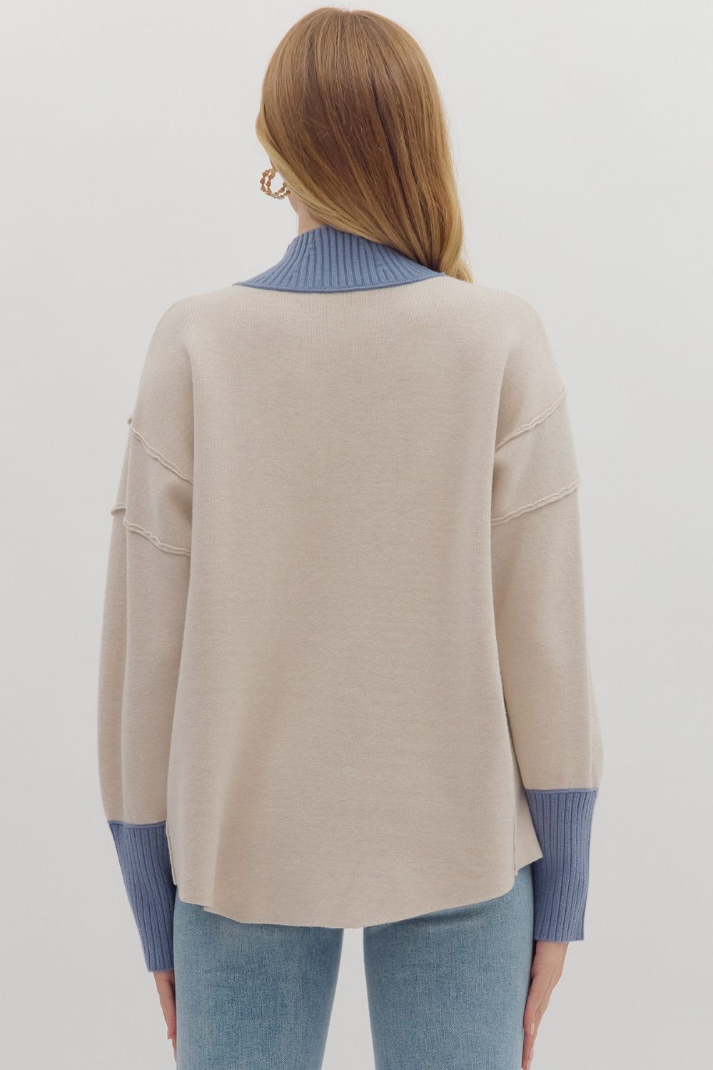 Women's ecru sweater knit pullover top with cornflower blue ribbed trim by Entro showing back view