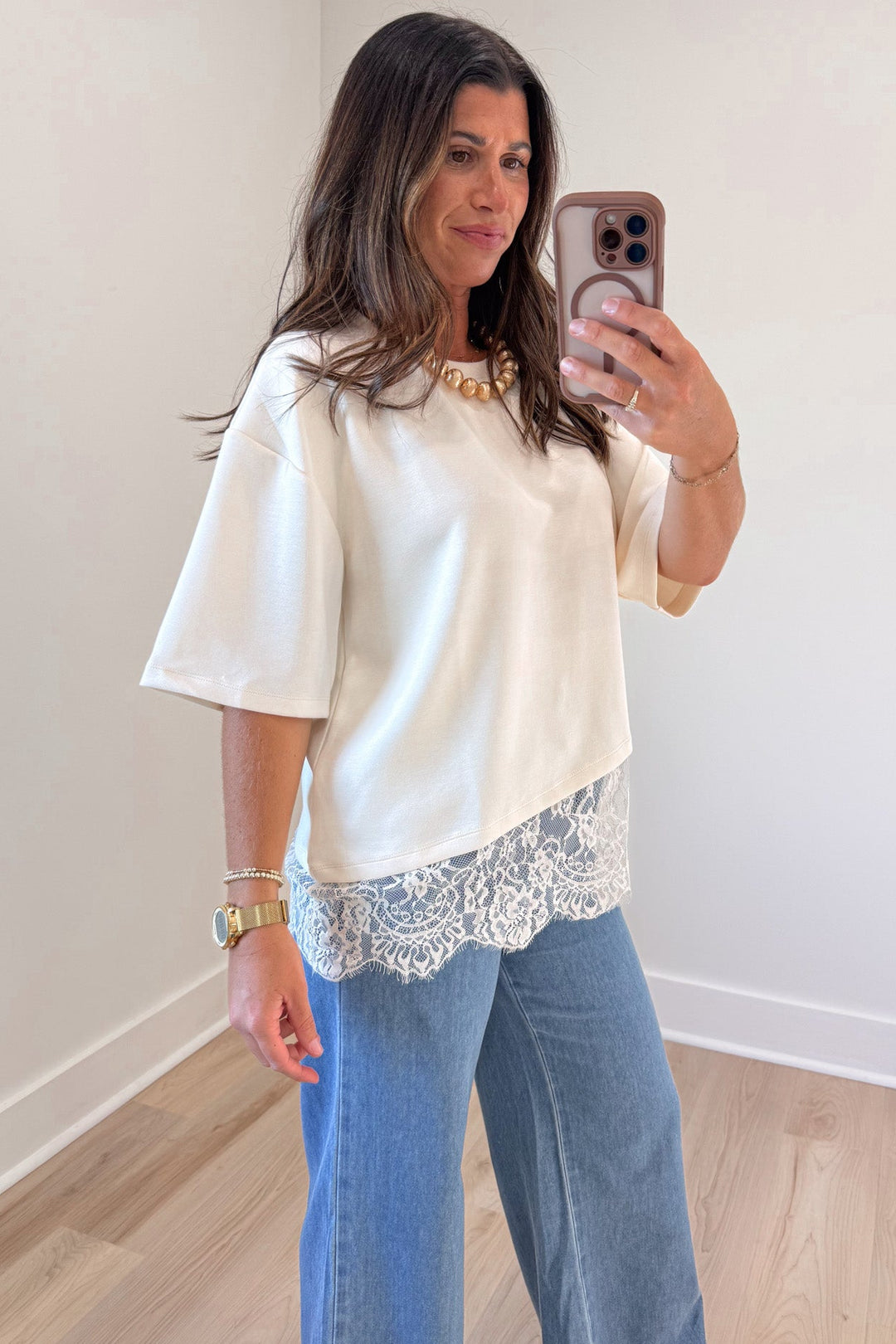 solid ecru asymmetrical tiered lace hem drop shoulder short sleeve crew neckline top