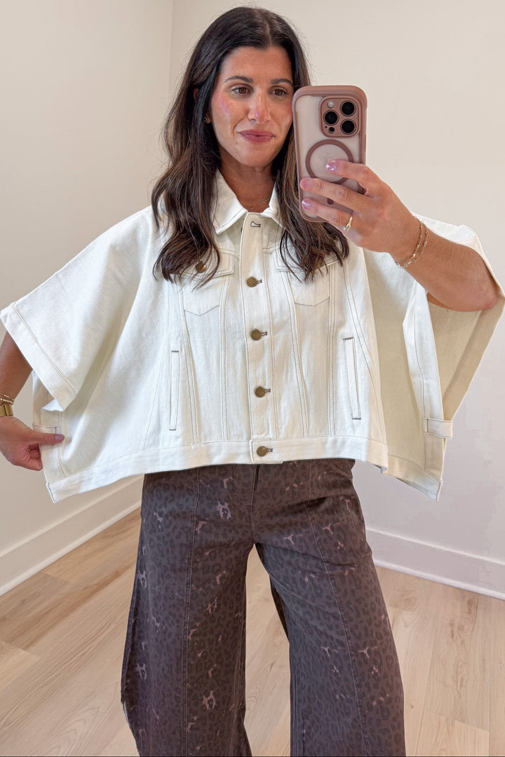 solid ecru short sleeve poncho style snap button front relaxed denim jacket with front pockets