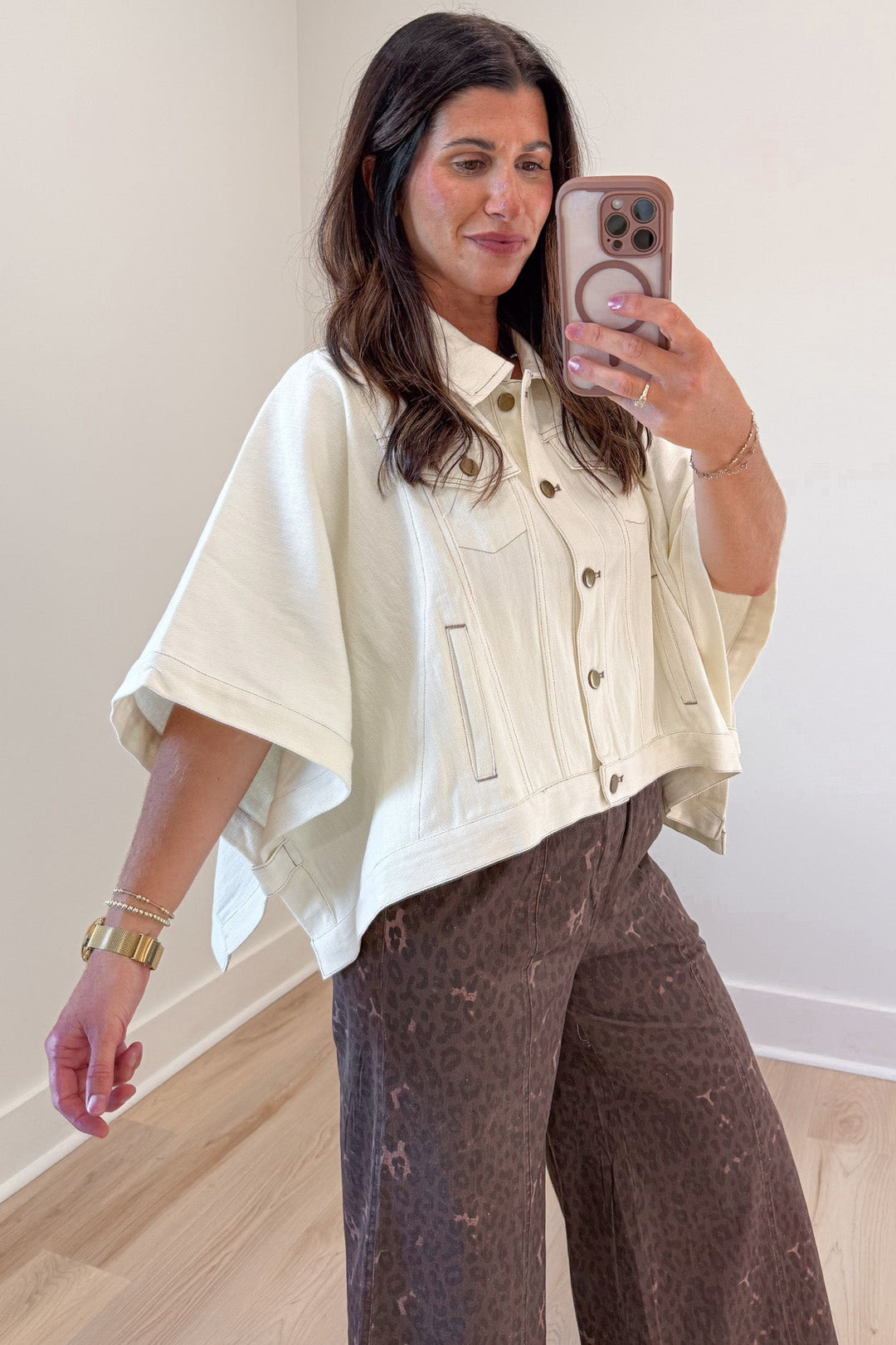 solid ecru short sleeve poncho style snap button front relaxed denim jacket with open sides