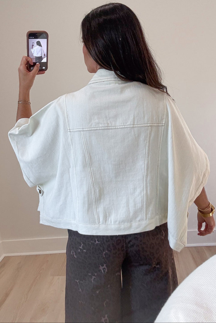 solid ecru drape short sleeve poncho style snap button front relaxed denim jacket
