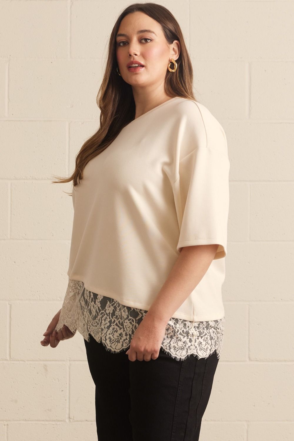 solid ecru asymmetrical tiered lace hem short sleeve crew neckline relaxed silhouette top plus size