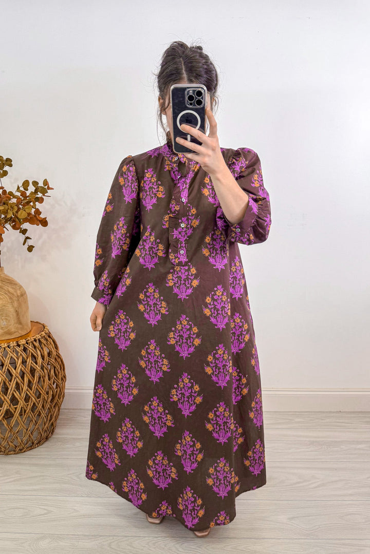 entro fall chocolate brown floral midi dress holding out 