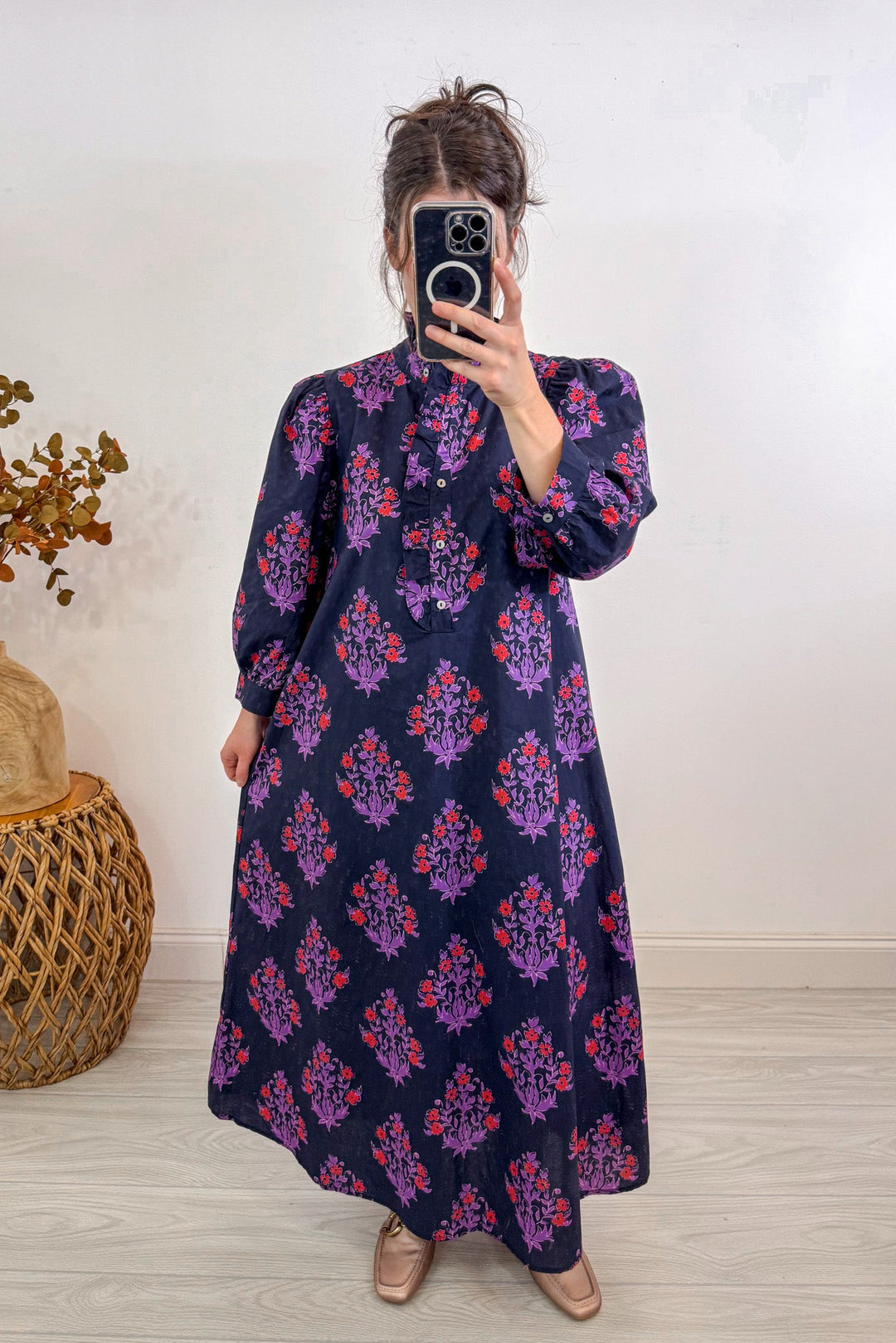 entro fall navy blue floral midi dress holding out 