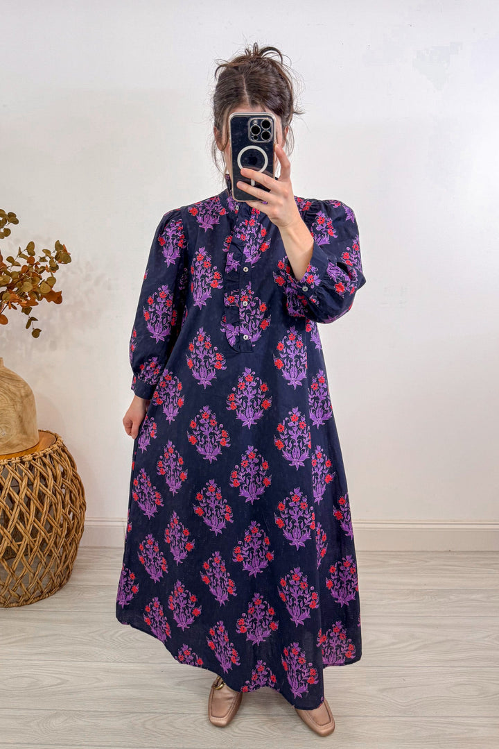 entro fall navy blue floral midi dress holding out 