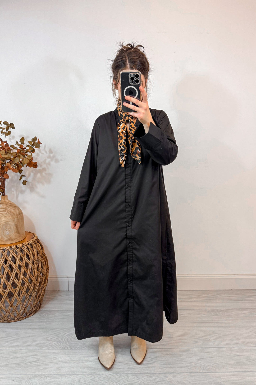 entro solid black button up dress holding