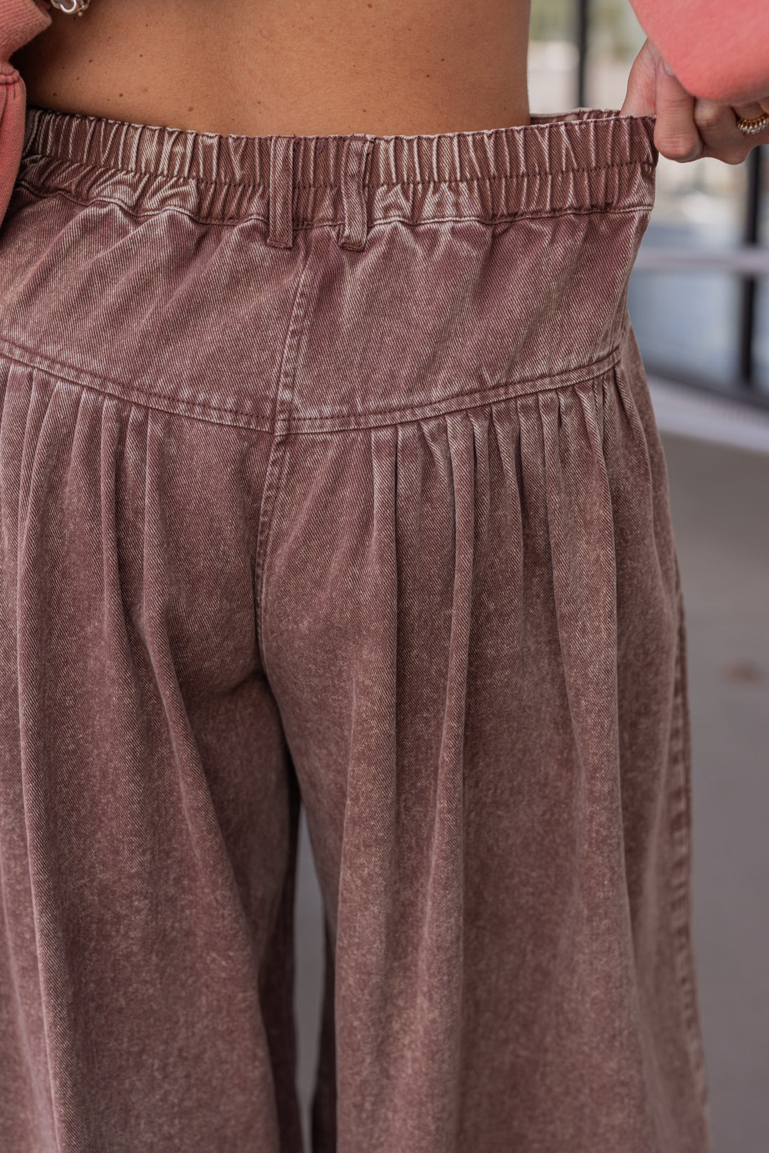 Women's brown washed twill denim exaggerated wide leg pleated pants by Fantastic Fawn showing elastic waistband