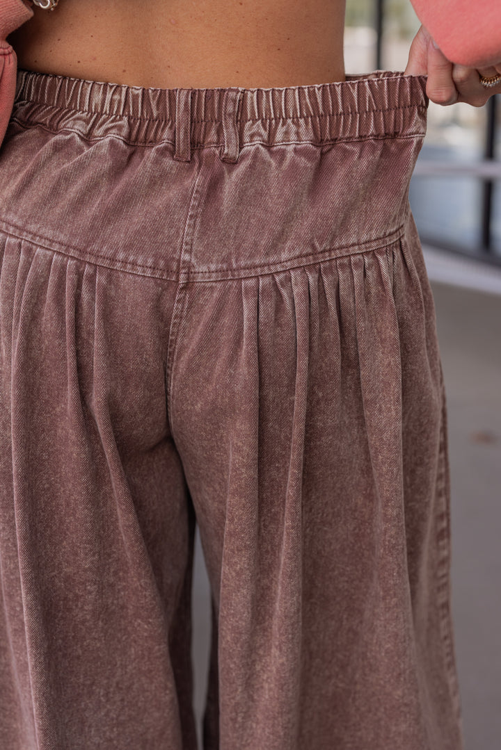 Women's brown washed twill denim exaggerated wide leg pleated pants by Fantastic Fawn showing elastic waistband