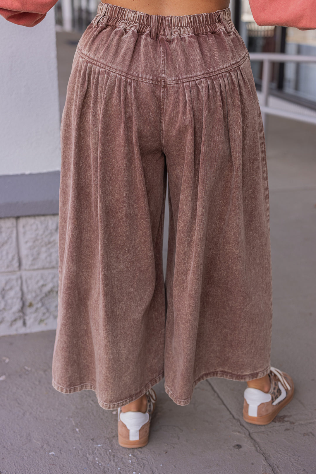 Women's brown washed twill denim exaggerated wide leg pleated pants by Fantastic Fawn showing back view