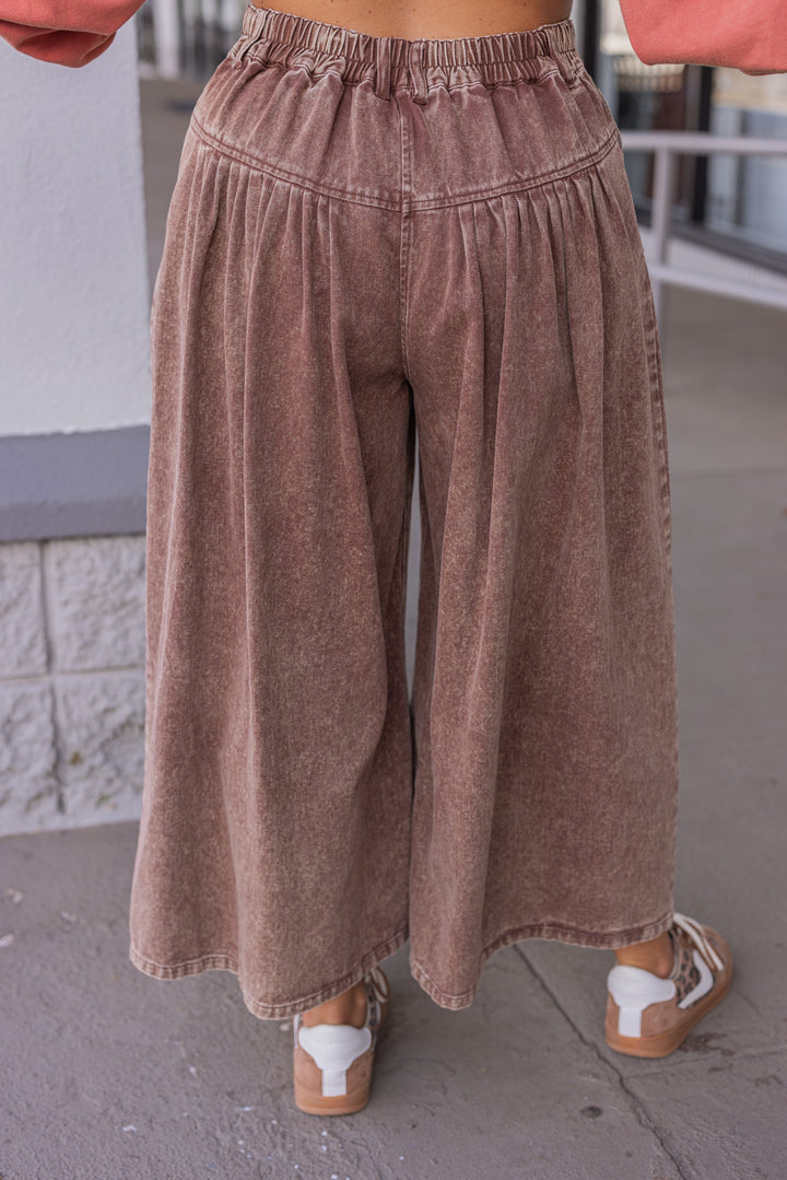 Women's brown washed twill denim exaggerated wide leg pleated pants by Fantastic Fawn showing back view