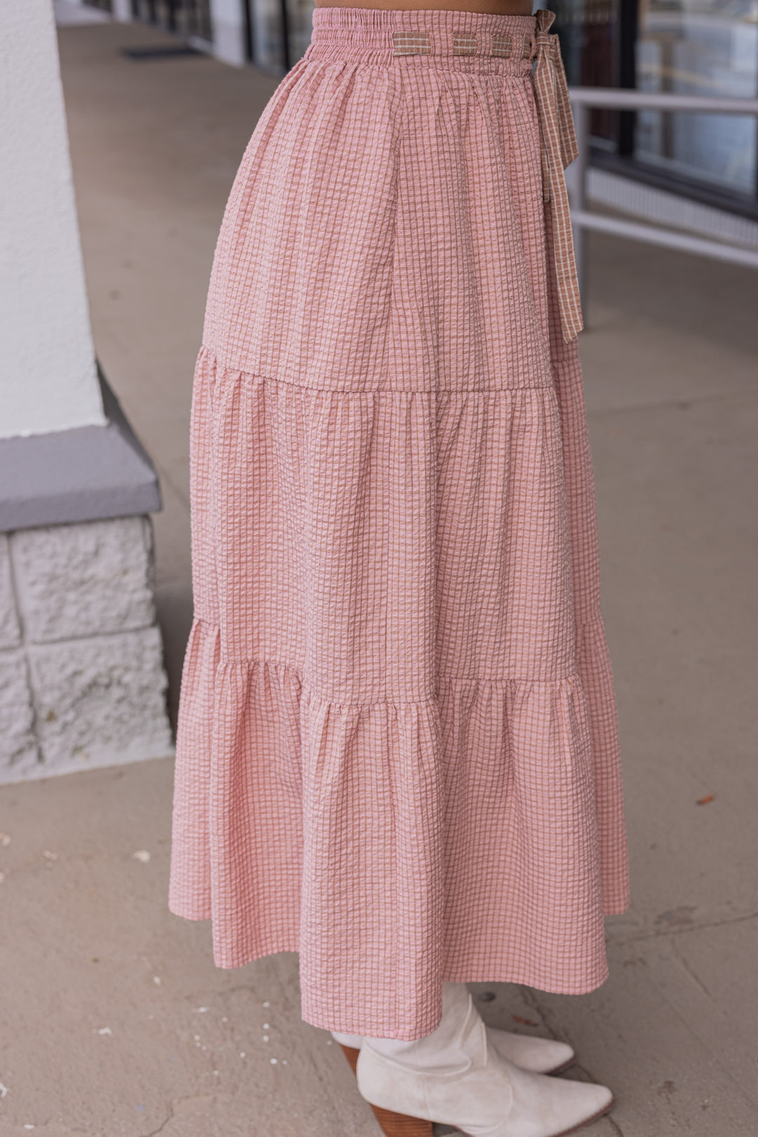 Women's mauve and mocha plaid print tiered midi skirt by Peach Love California showing up close side view