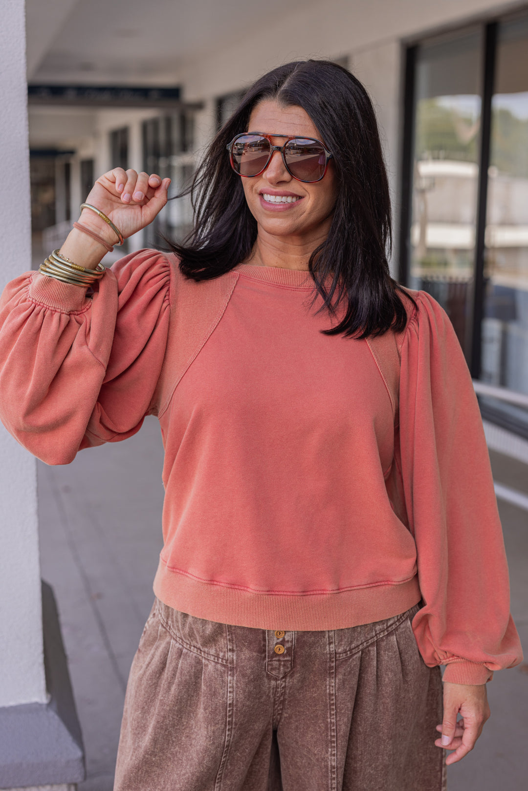 Mineral washed rust balloon sleeve pullover sweatshirt with ribbed details by Jodifl showing up close front view