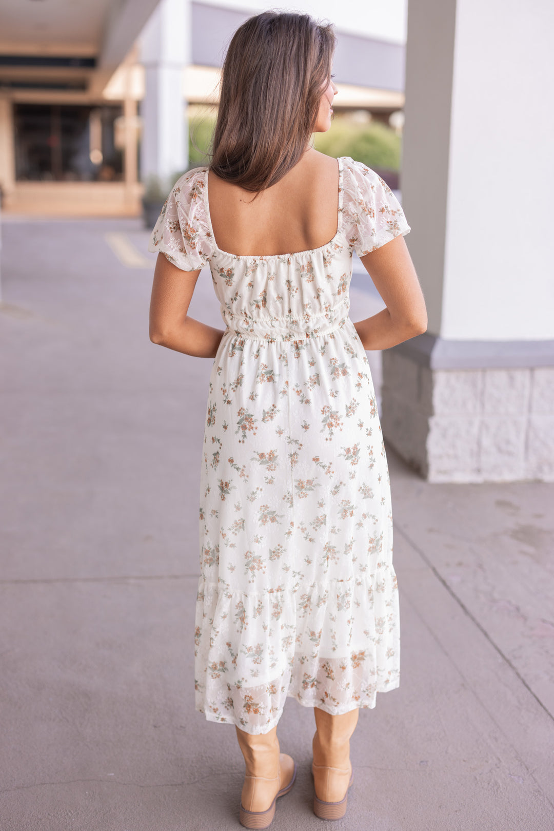 Women's cream midi dress with mustard and olive floral print sheer overlay by Blu Pepper showing full back view