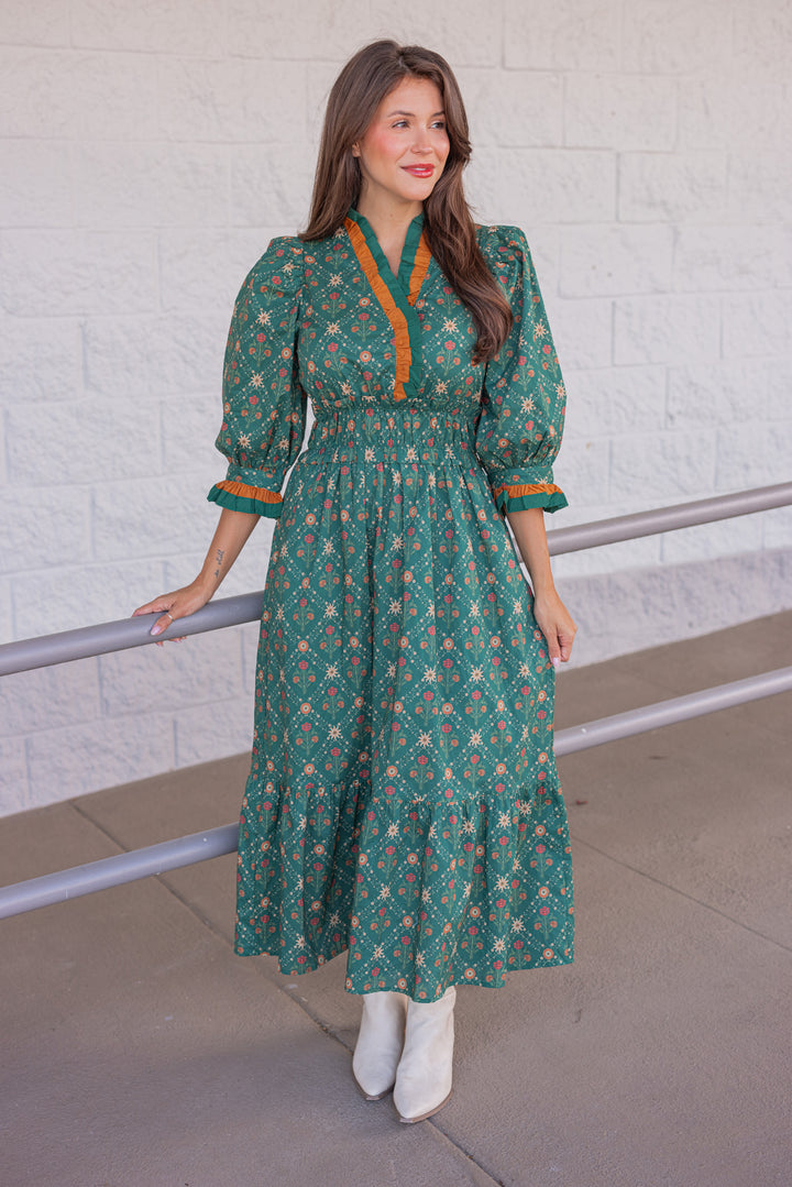 Women's hunter green midi dress with rust and taupe floral print and ruffle trim by Entro