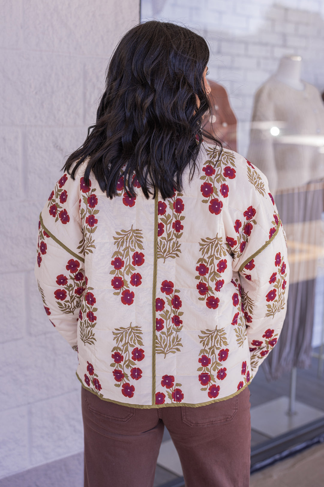 Women's ecru, dark red and olive floral print quilted puffer jacket by Entro showing back view