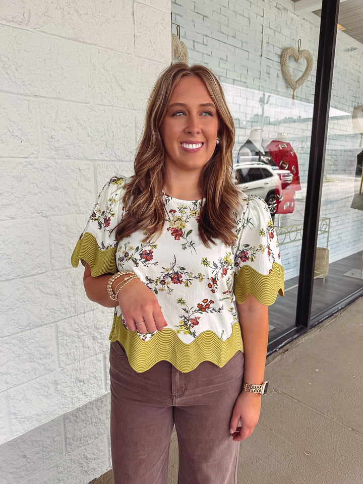 Women's ecru multicolor floral print top with moss green scalloped trim by Entro
