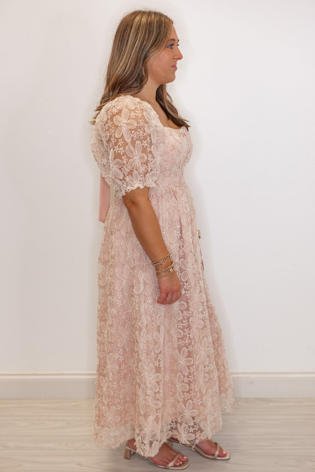 Women's dusty pink floral midi dress with sequins and gold metallic details by In February showing full side view