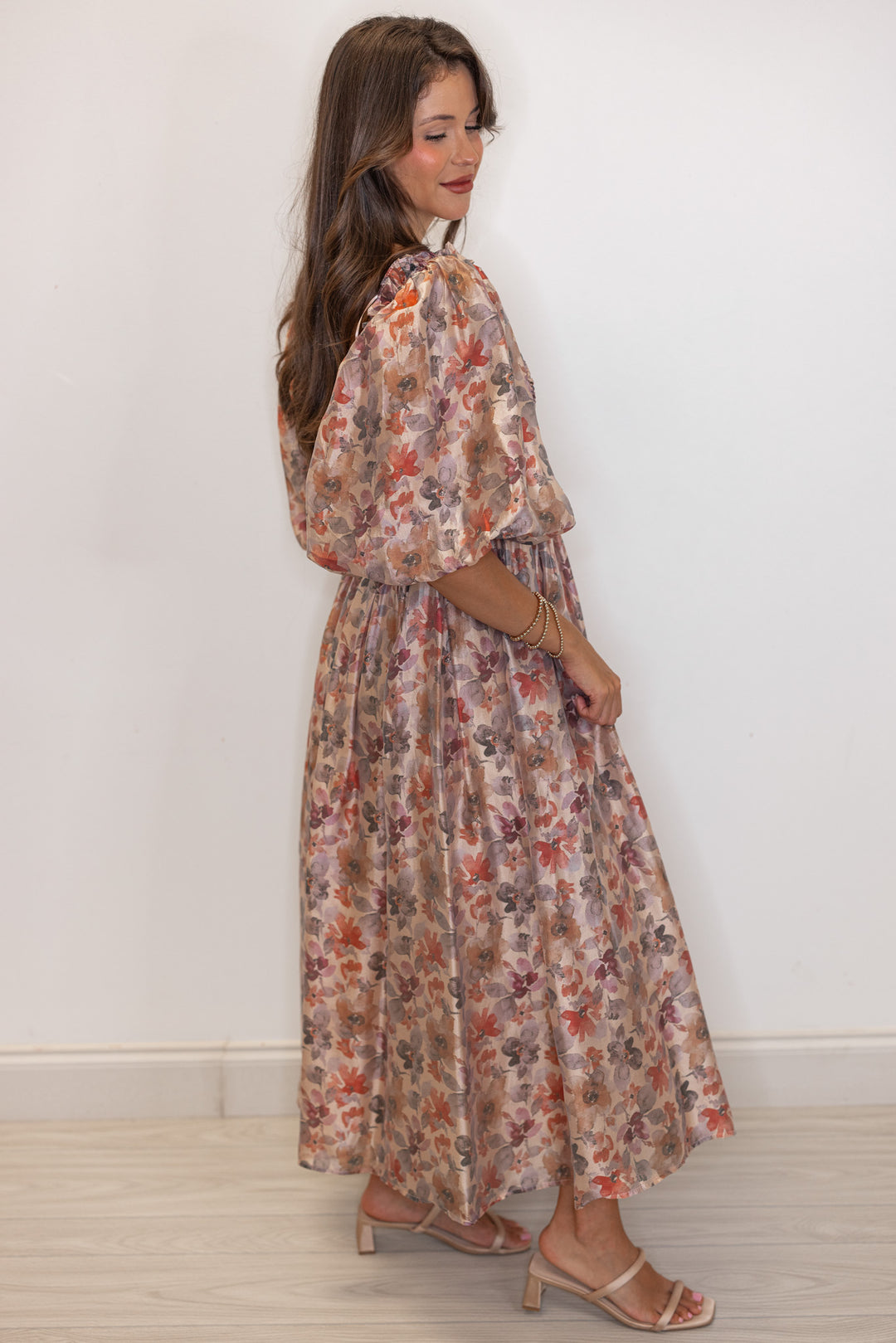 Women's champagne and multicolor floral chiffon midi dress with smocked bodice by Sofie the Label showing full side view
