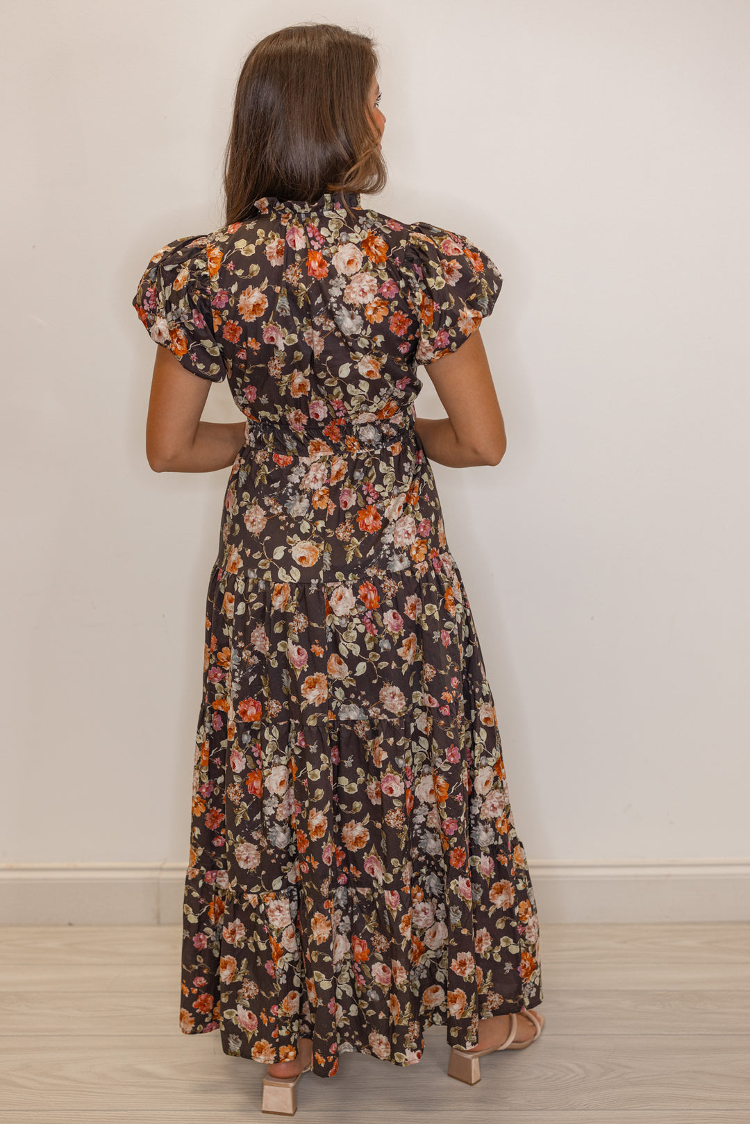 Women's chocolate brown midi dress with empire waist and multicolor floral print by Entro showing full back view