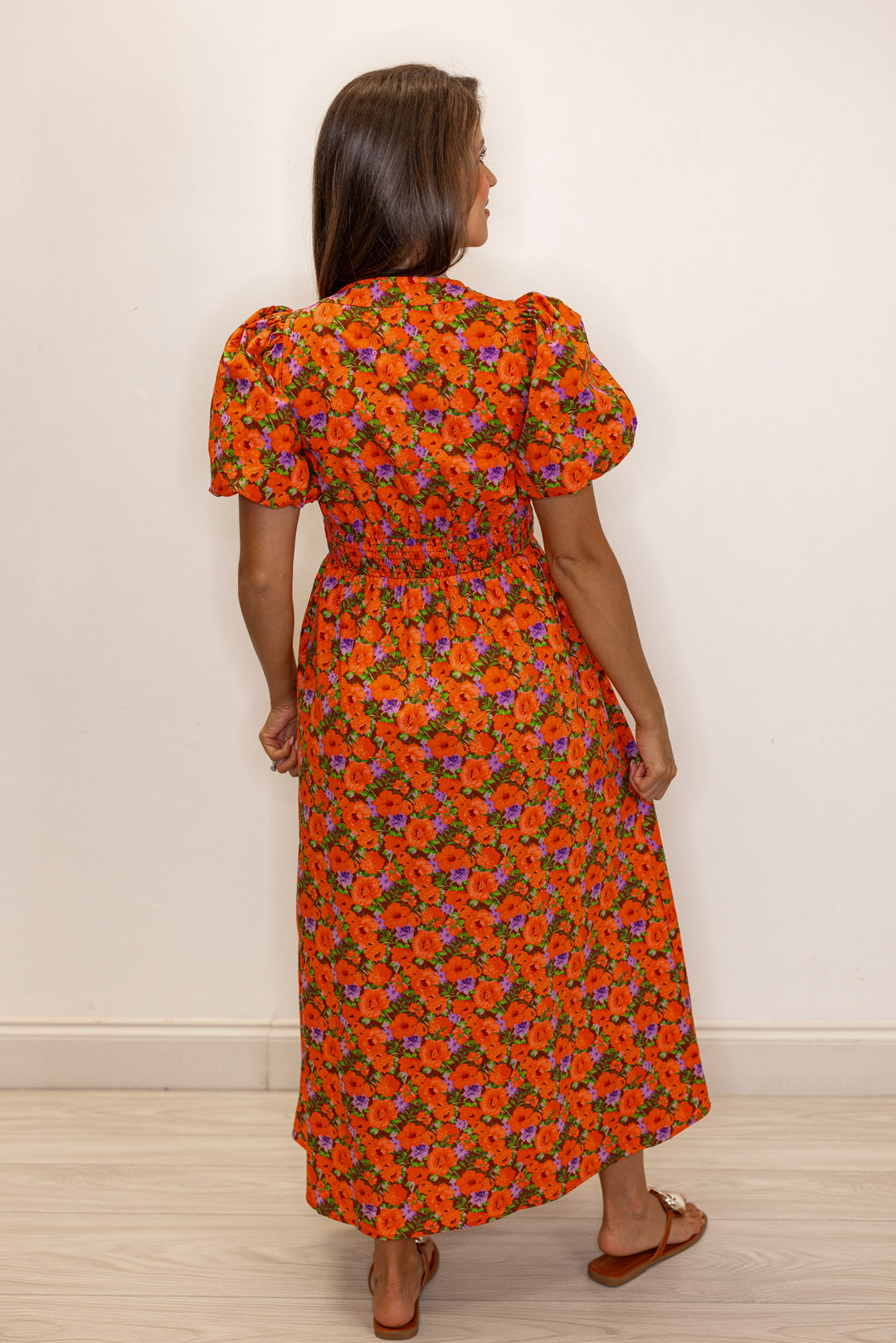 Women's zipper front midi dress with rust, brown and purple floral print by Fantastic Fawn showing full back view