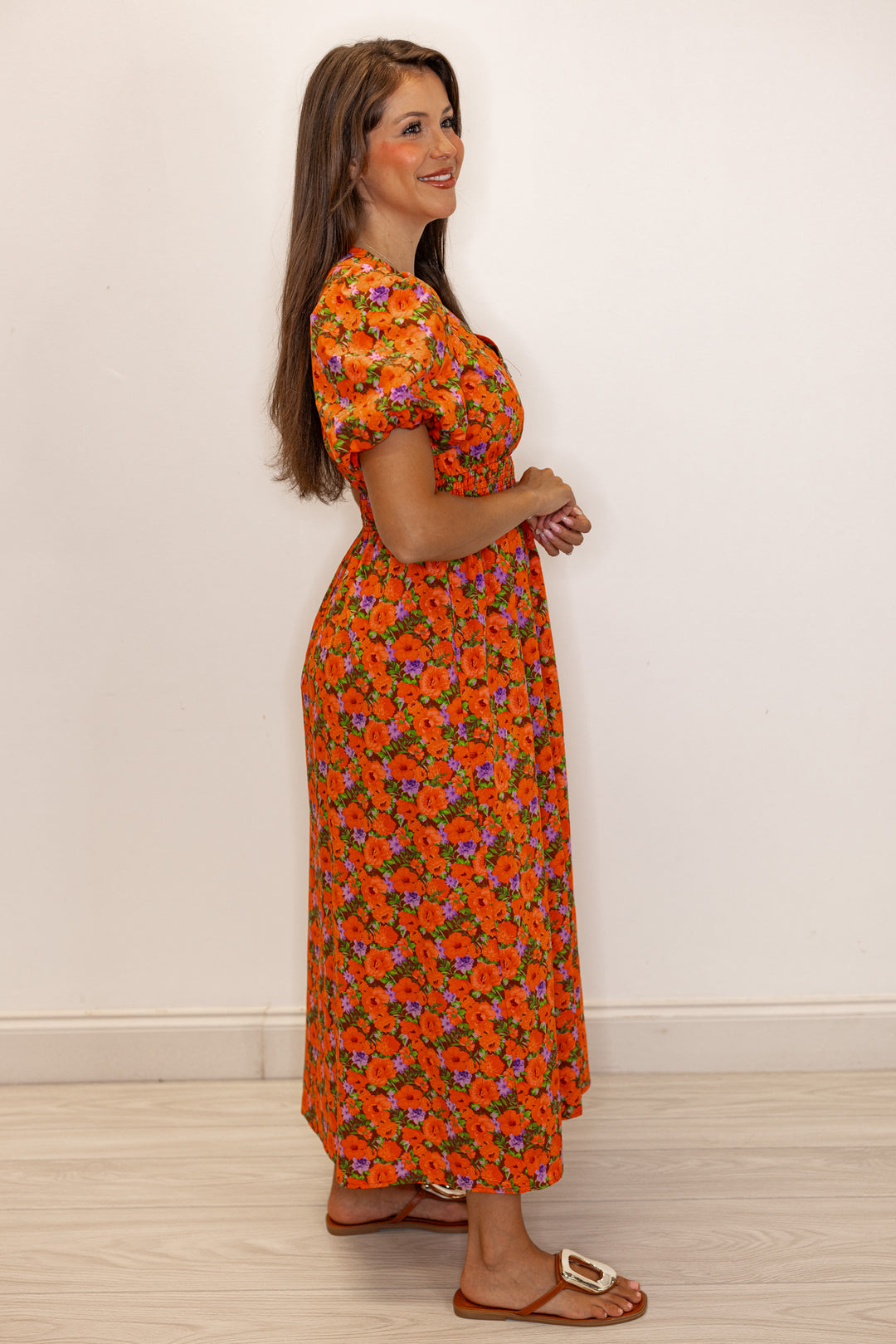 Women's zipper front midi dress with rust, brown and purple floral print by Fantastic Fawn showing full side view