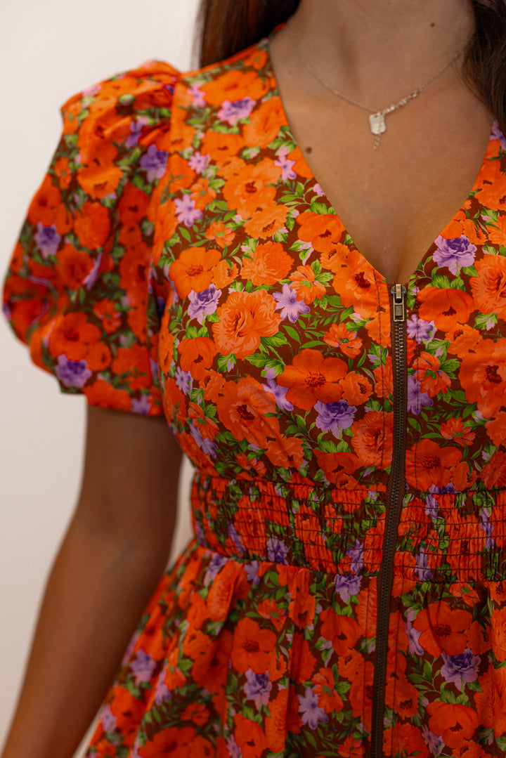 Women's zipper front midi dress with rust, brown and purple floral print by Fantastic Fawn showing zipper front detail