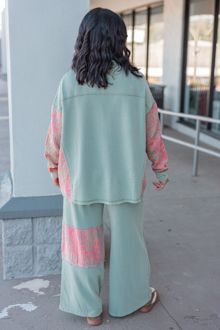 Women's french terry knit sage pants with frayed floral patch gauze details by Easel showing full back view