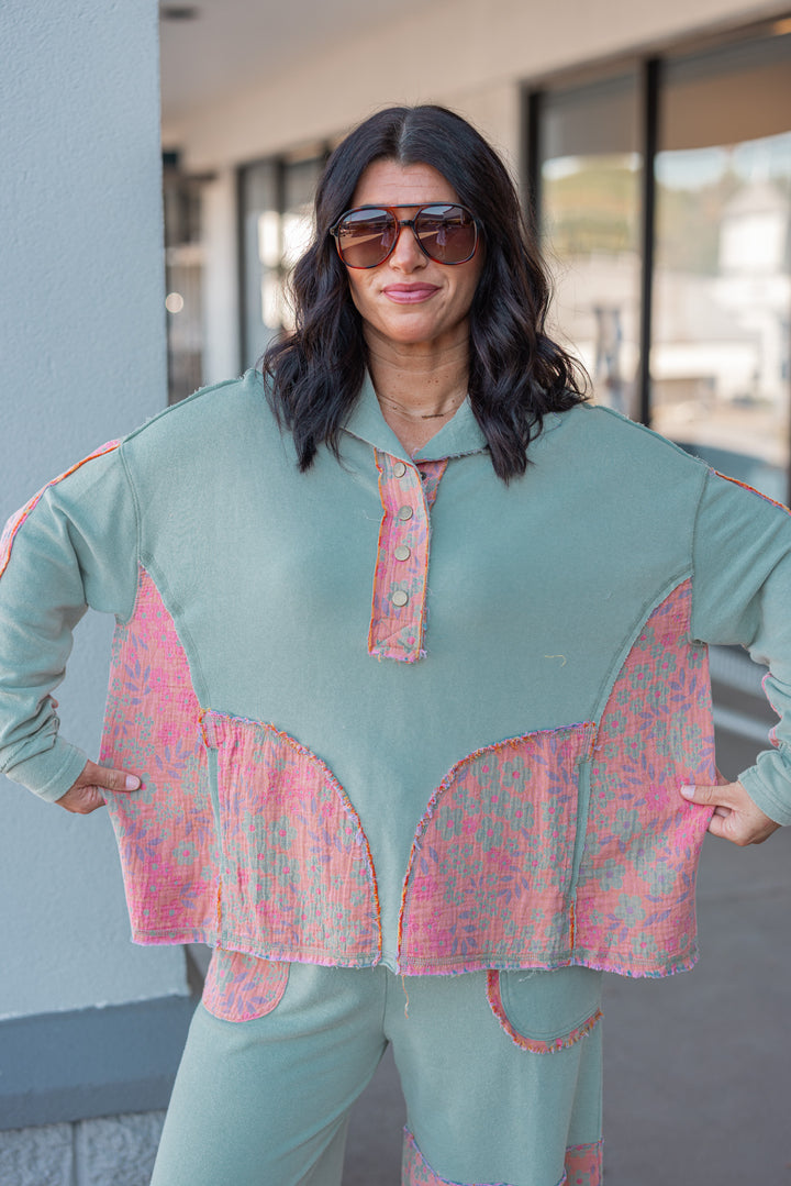 Women's french terry knit sage pullover top with frayed floral patch gauze details by Easel showing relaxed fit