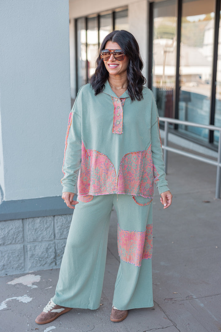 Women's french terry knit sage pullover top with frayed floral patch gauze details by Easel showing full front view