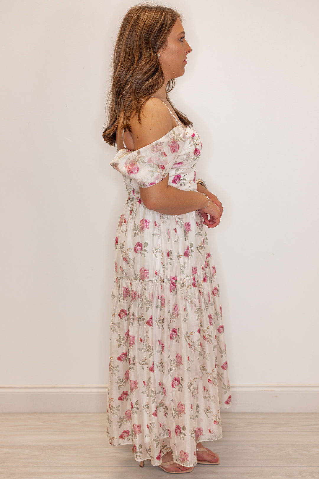 Off white with pink floral print event dress for women and teens. Side view 