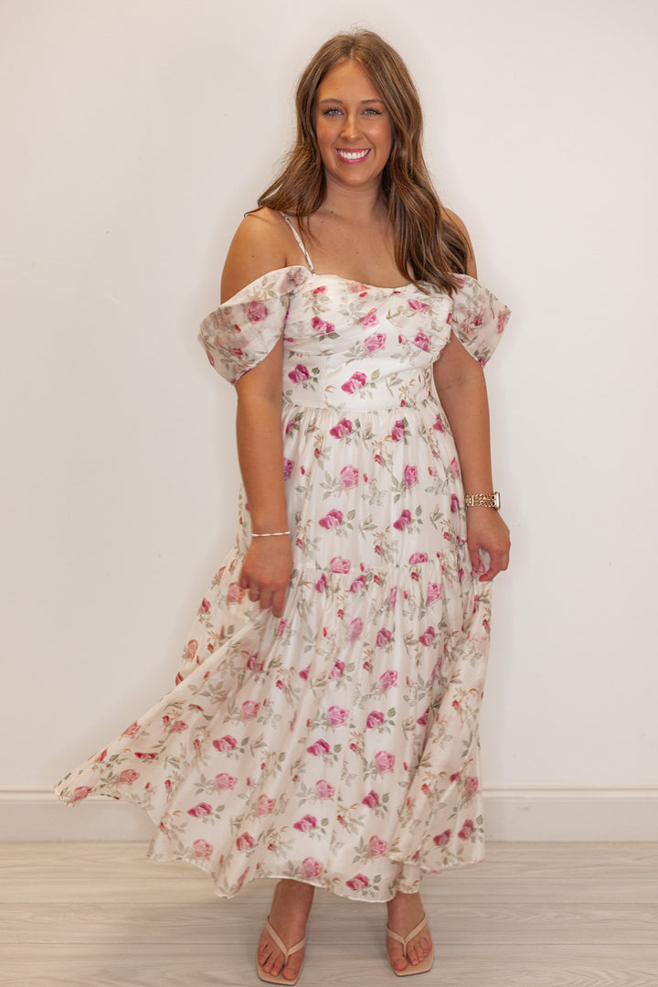 Women’s Off white tiered midi dress with pink floral print and off the shoulder design. 