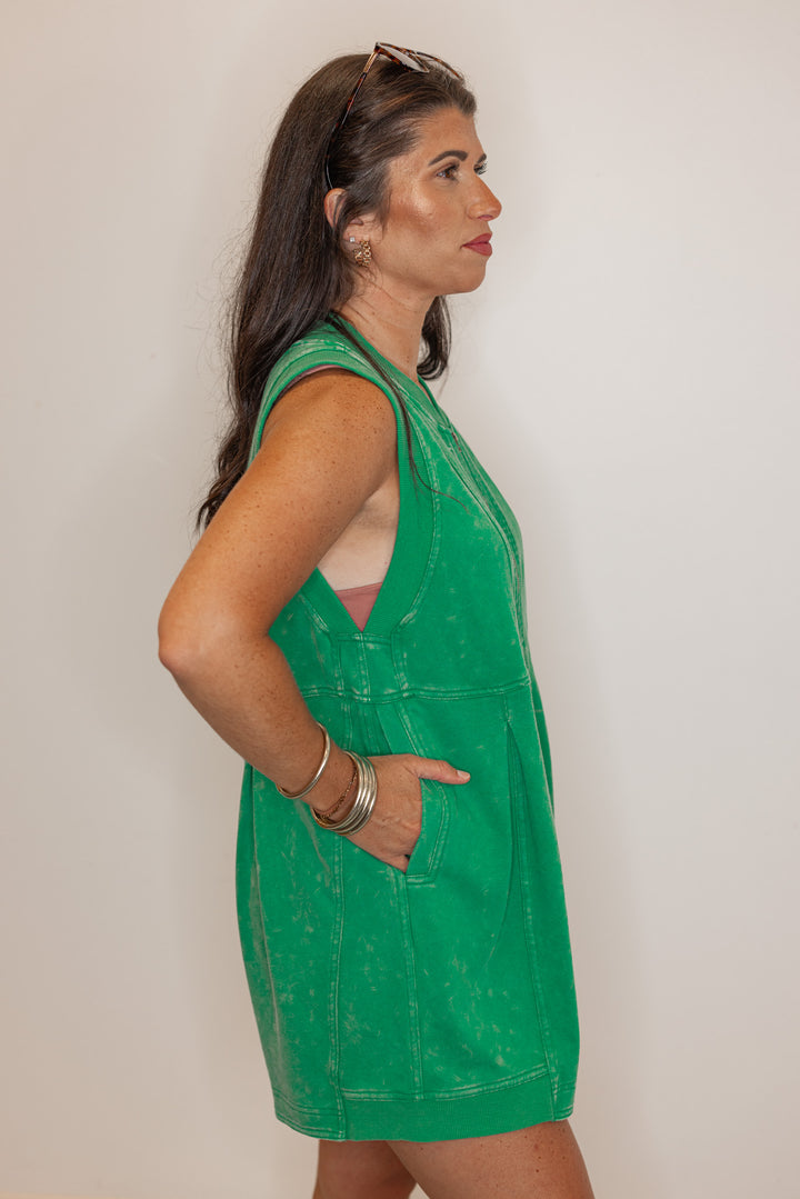Women’s emerald green, easy fitting romper, showing side view. 