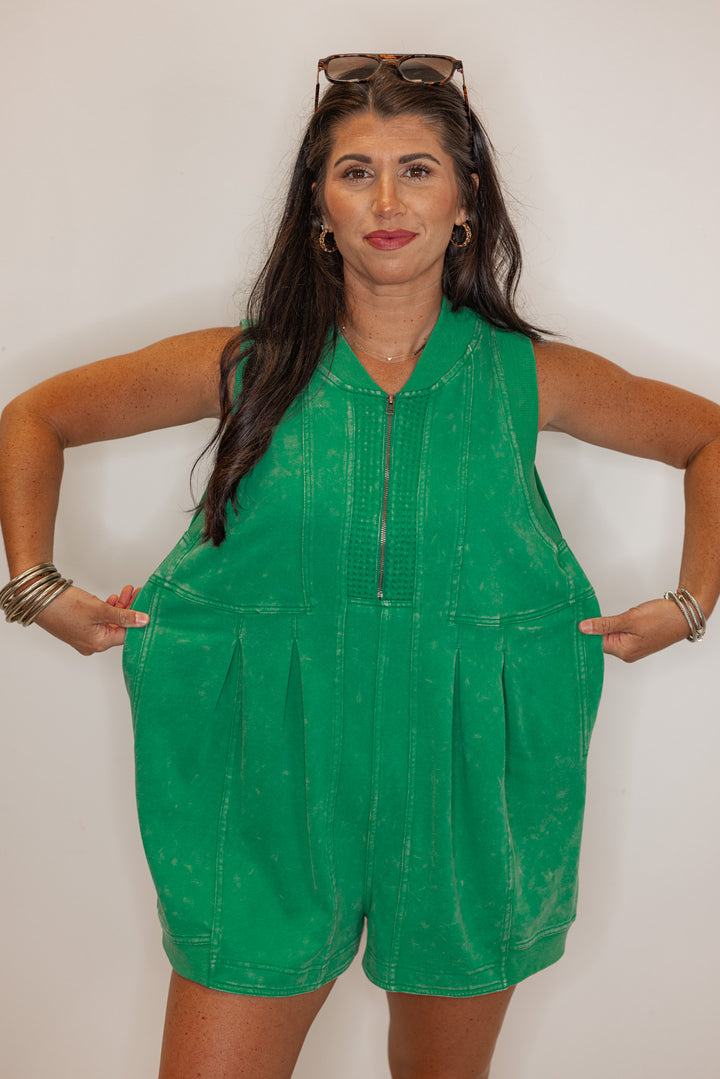 Women’s emerald green, easy fitting romper, showing the oversized fit. 