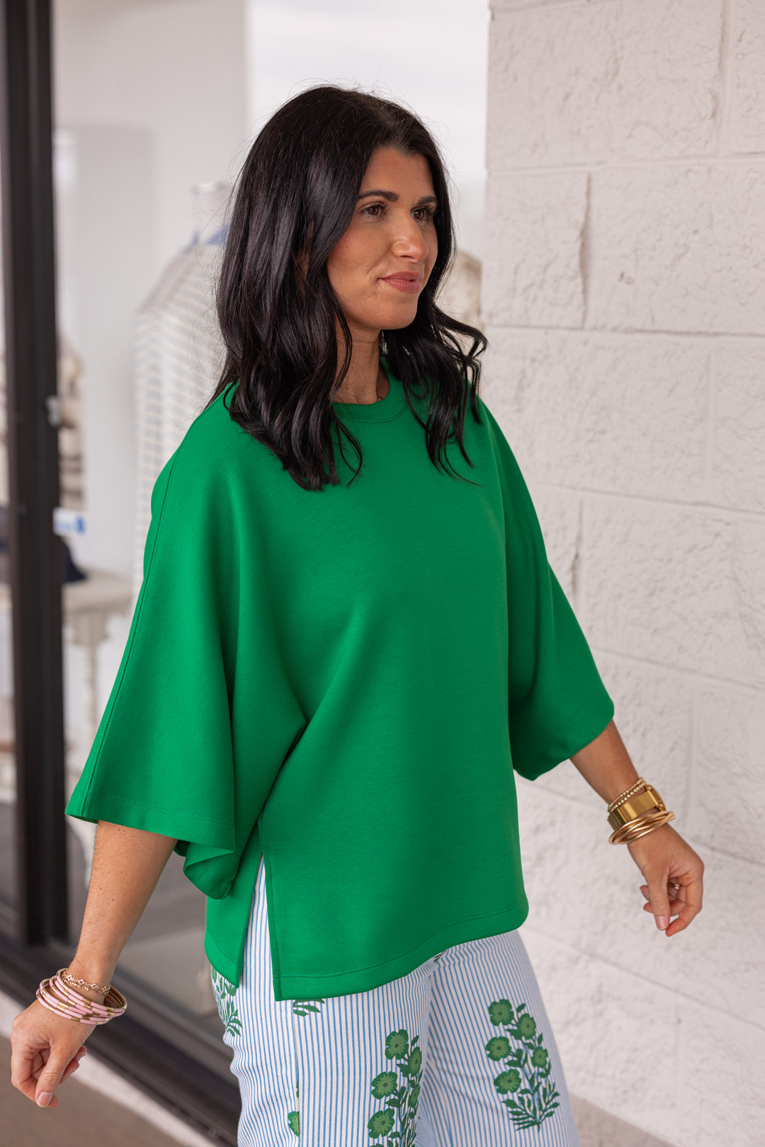 Green scuba knit short sleeve top with side slits