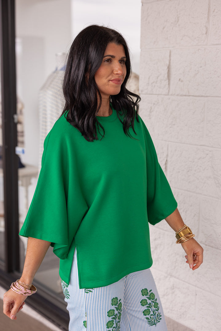 Green scuba knit short sleeve top with side slits