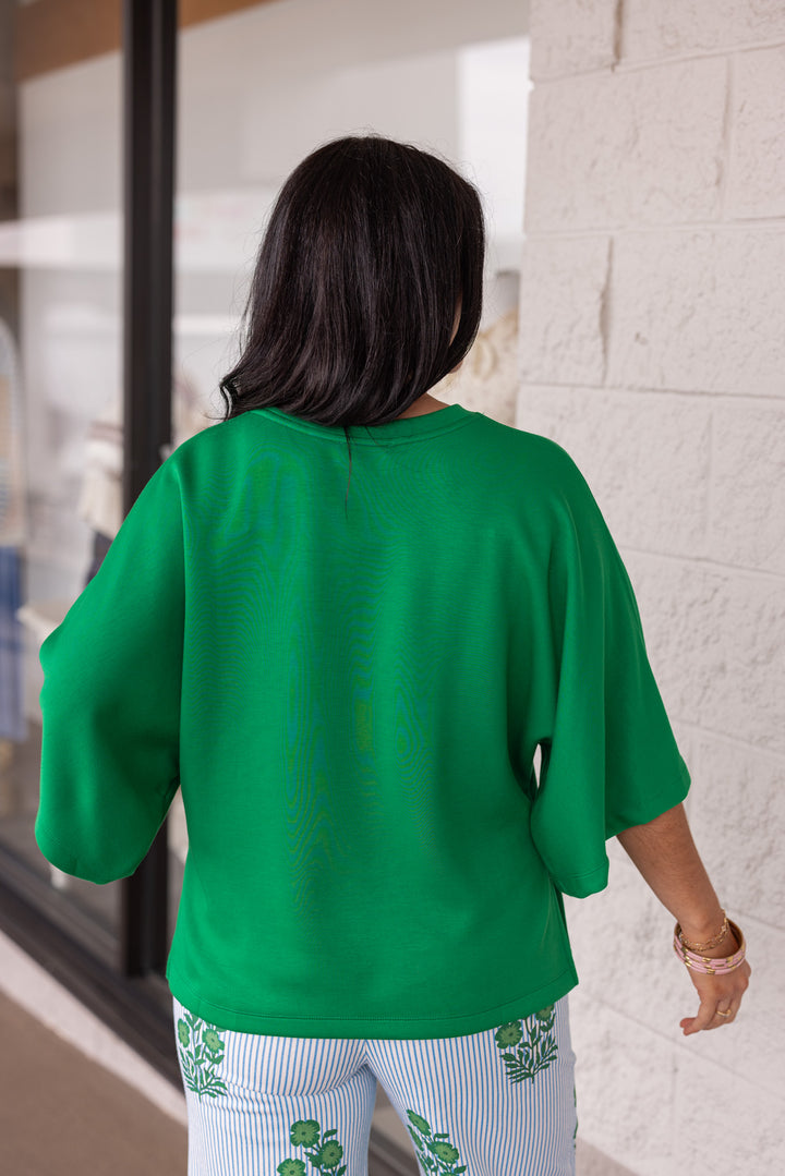 Green scuba knit short sleeve top back