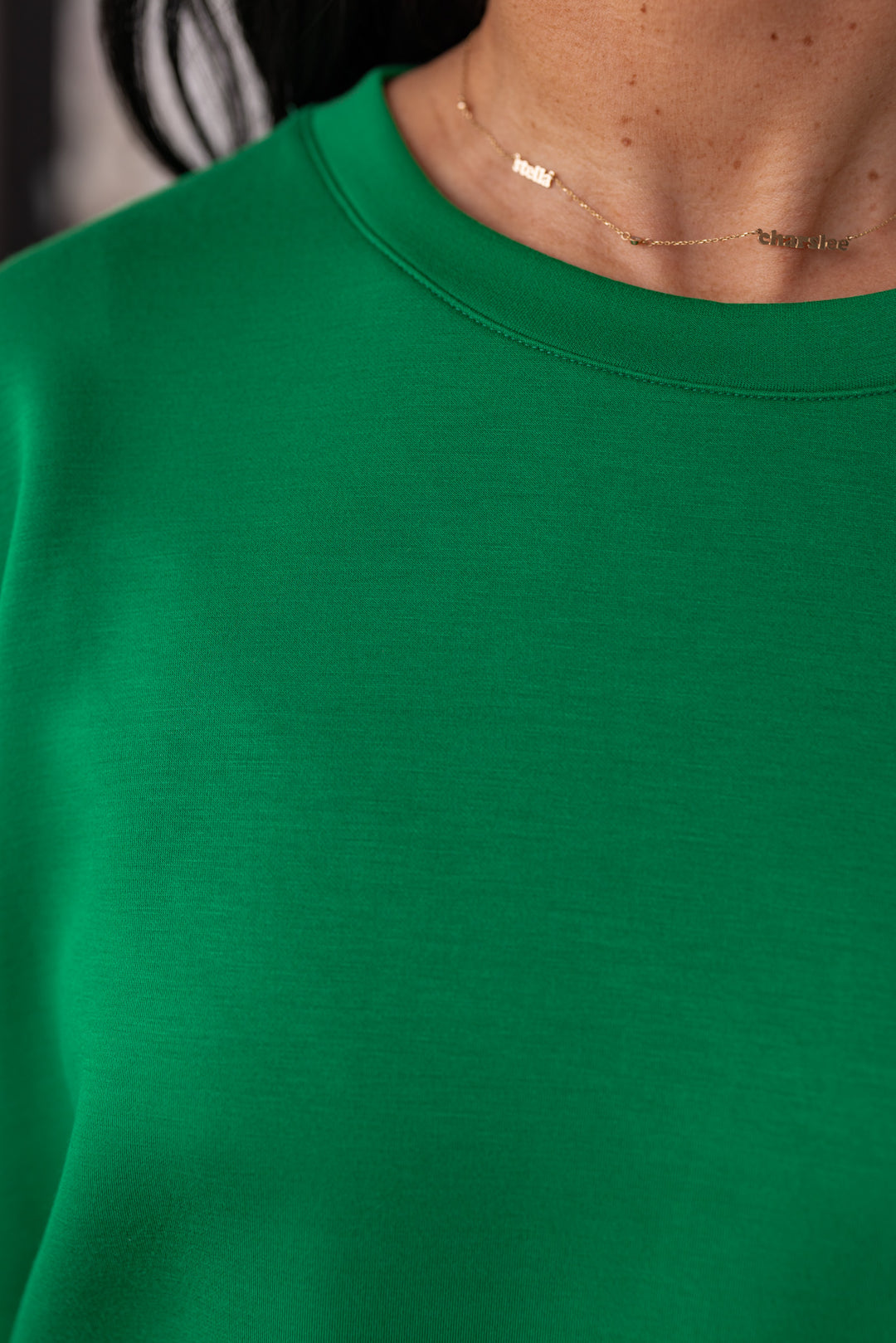 Green scuba knit short sleeve casual top