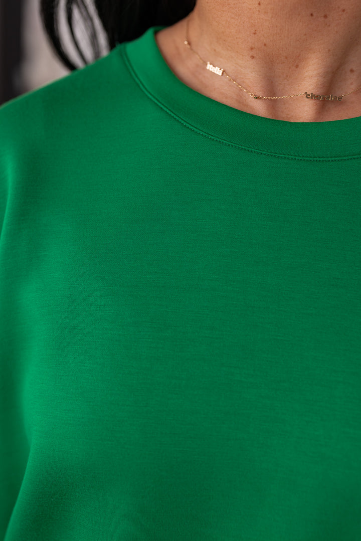 Green scuba knit short sleeve casual top