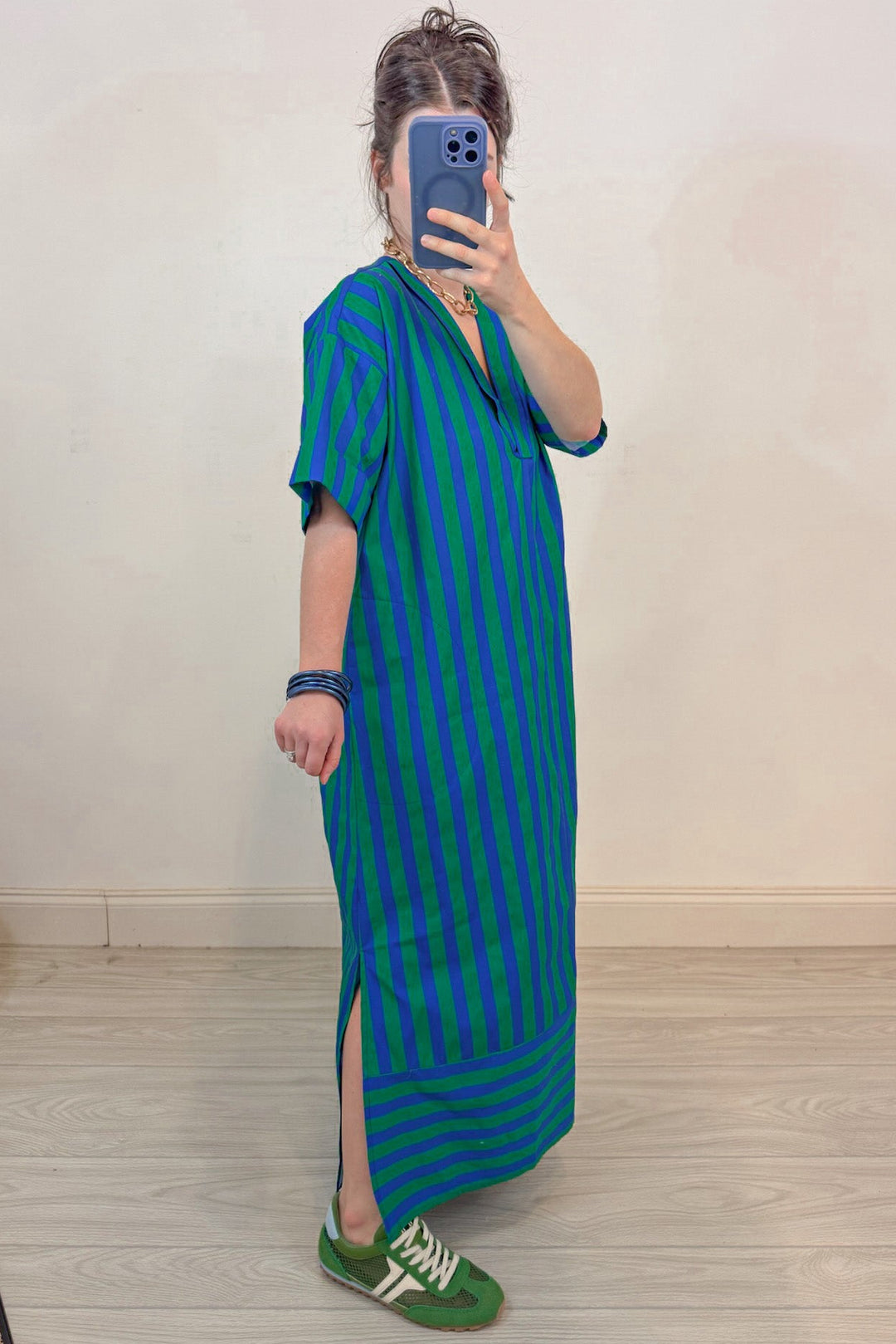 green and blue alternating striped midi dress with side slits at hem