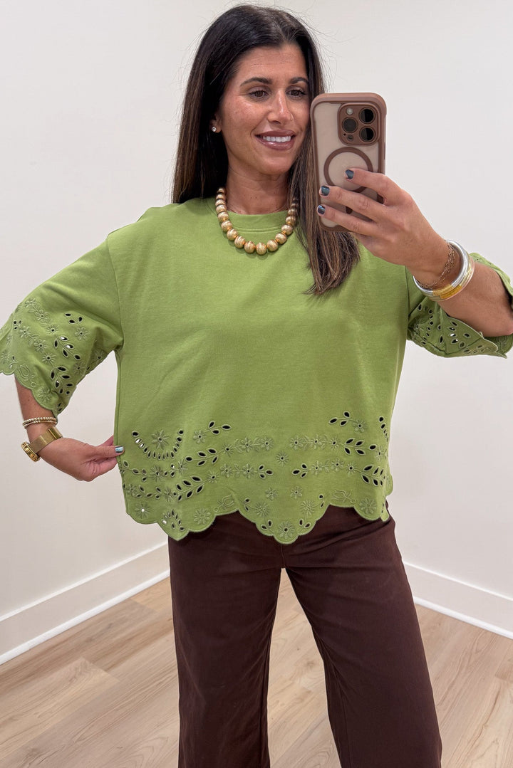 solid grass green floral eyelet accents scalloped hem half sleeve relaxed silhouette knit top