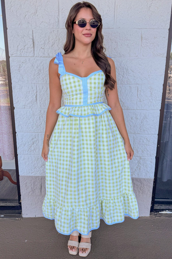 honeydew green gingham print with light blue trim details peplum style ruffled hem midi dress