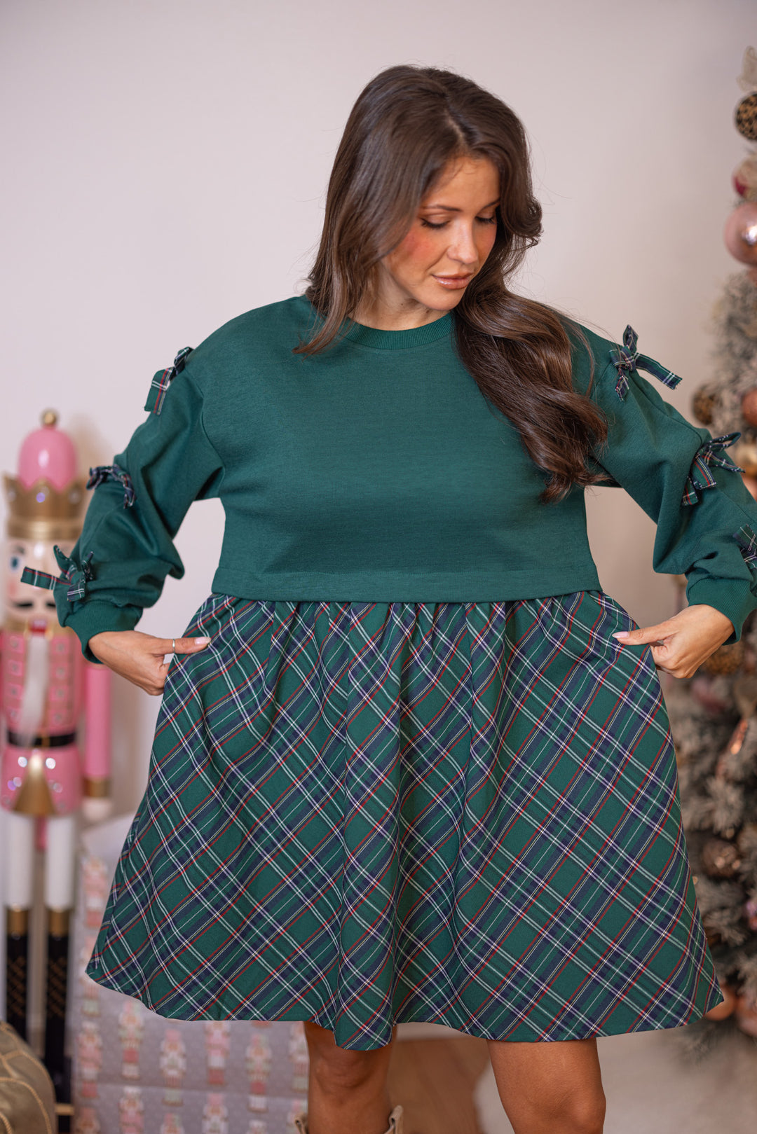 Women's green dress with knit top and contrasting plaid skirt by She & Sky showing true to size fit