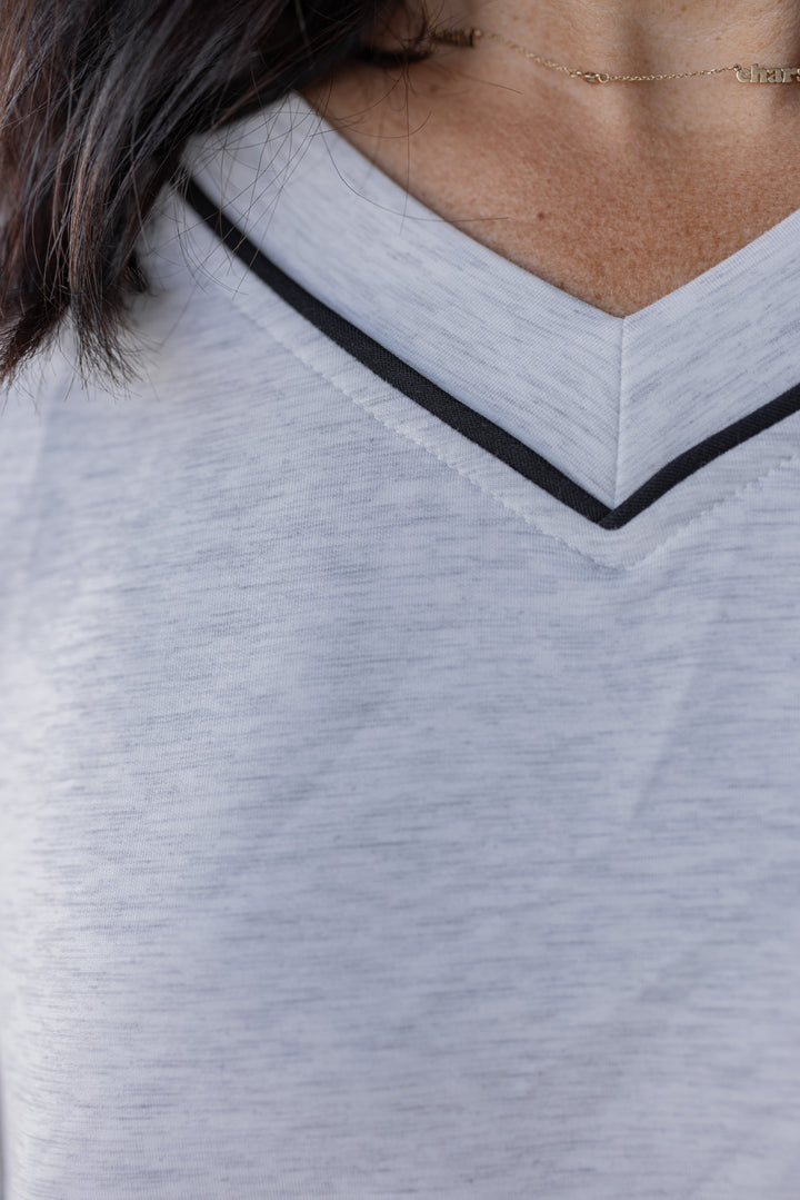 Women's grey and black striped piping scuba knit top by Rae Mode showing neckline details